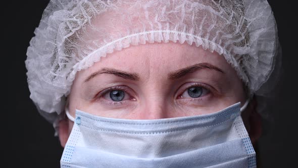 Girl in a Protective Medical Mask. People Are Afraid of Contracting the Covid-19 Virus. The Epidemic
