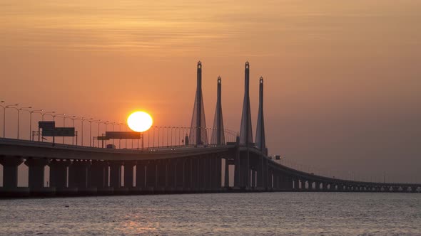 Timelapse egg yolk sunrise at Penang Second Bridge