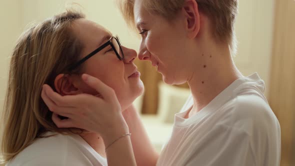 Two Young Beautiful Lgbt Women Hugging and Kissing Close Up