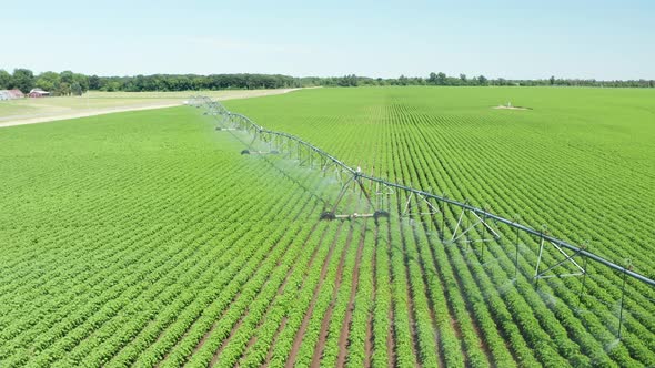 Aerial, agriculture crop irrigation machine using center pivot sprinkler system. Automatic irrigatio