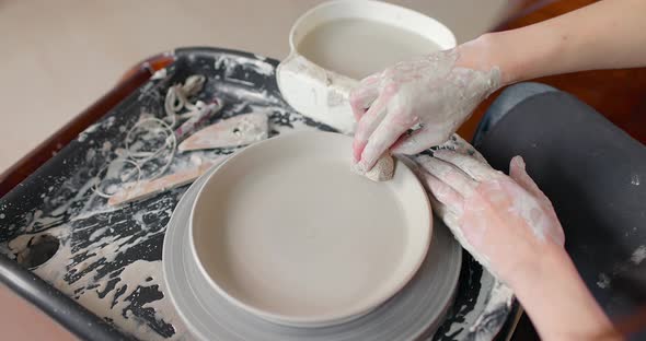 Hands of Young Woman in Pottery Studio Using Pottery Wheel Handmade Ceramics Creative