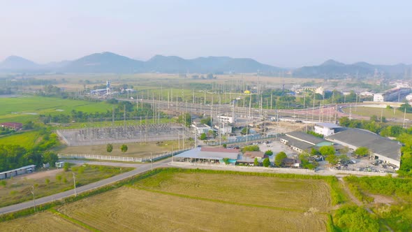 Aerial view of electricity generating, voltage poles. Power lines on utility tower and cable wires