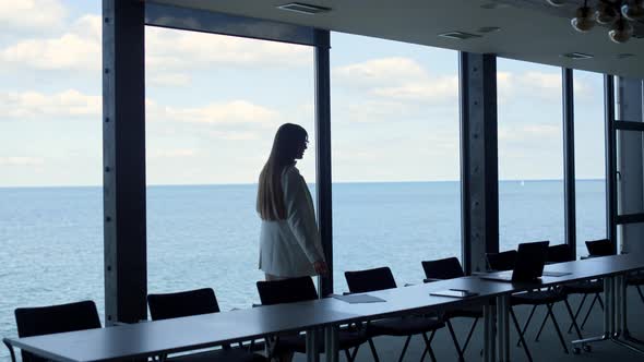 Corporate Manager Throwing Papers on Table in Conference Hall