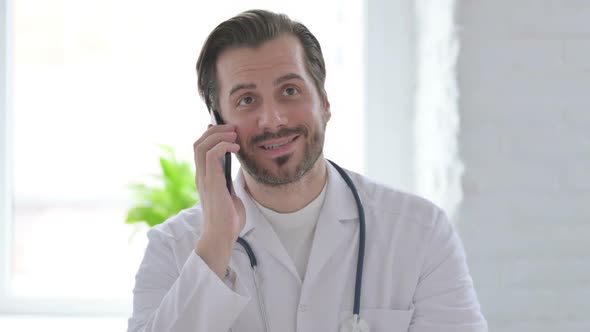 Portrait of Young Doctor Talking on Phone