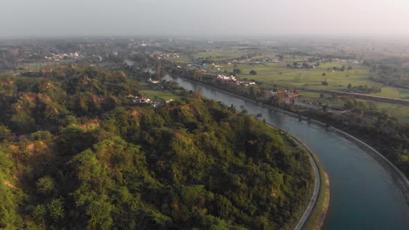 View of crystal clear water of Satluj River is flowing in the middle of the greenery of the Punjab a