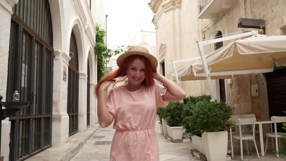 Happy Young Woman Tourist Walking Through Streets of Old European City Slow Motion