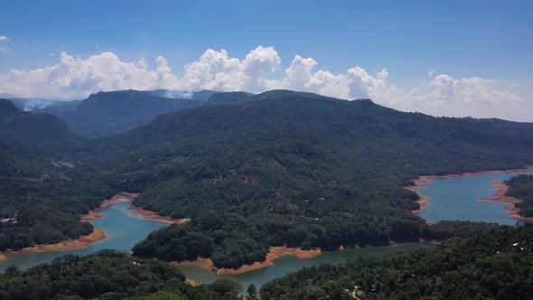 Aerial view of a river crossing the forest in Nuwara Eliya, Sri Lanka.