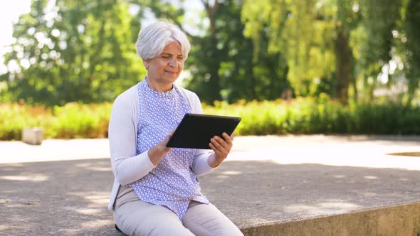 Senior Woman with Tablet Pc at Summer Park 19