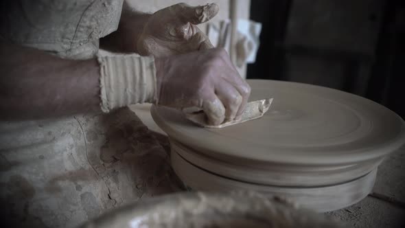 Profile of Potter Working on Pottery Closeup View