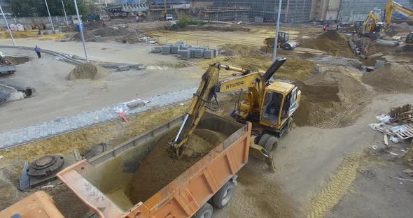 Aerial View of Construction Site with Working Machinery