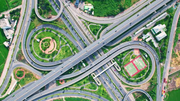 Aerial view shot of fast moving above interchange and multi junction road