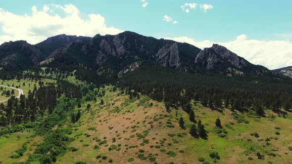 Aerial Dolly of Colorado Mountaintop Trees at Bottom, Wide Angle Drone Shot