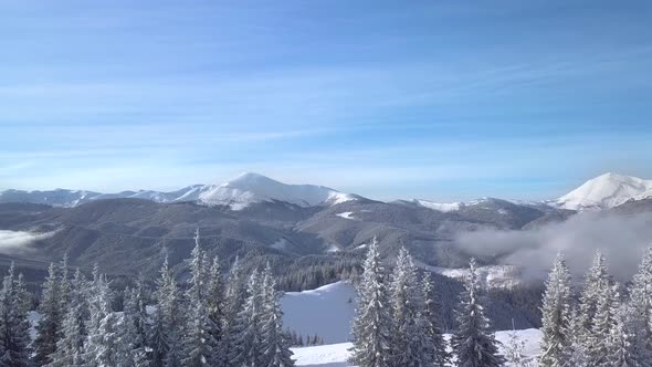 Flying Over Beautiful Landscape of Winter Mountains