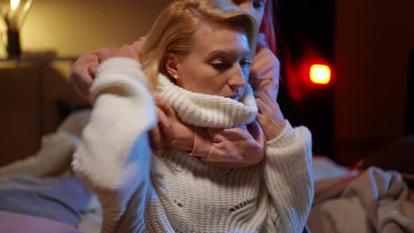 Portrait of Stressed Anxious Mother and Daughter Get Scared As Red Airraid Alert Warning Lamp