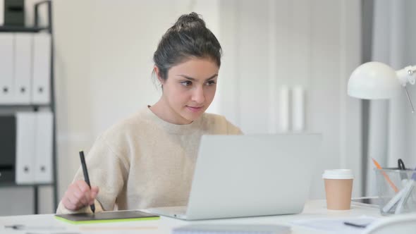 Indian Woman Drawing on Graphic Tablet