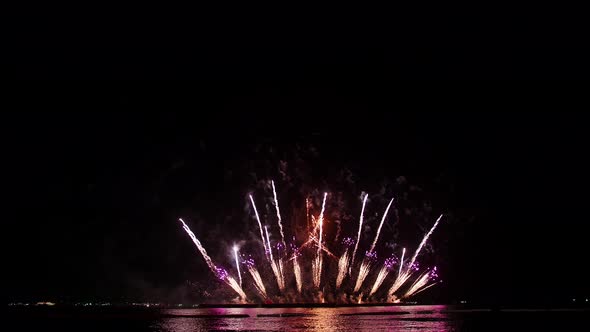 Big colorful real fireworks display celebration in New year's eve with an abstract blur of golden sh