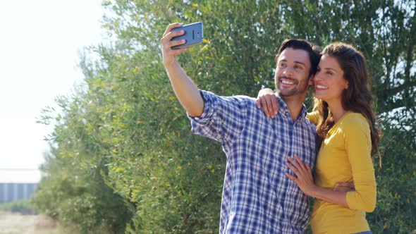 Happy couple taking selfie from mobile 4k