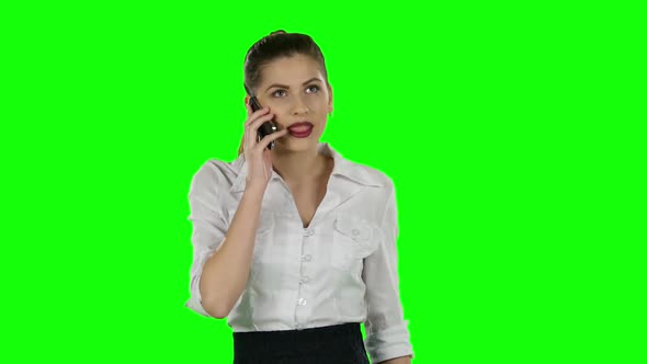 Pretty Businesswoman Talking on the Phone. Green Screen