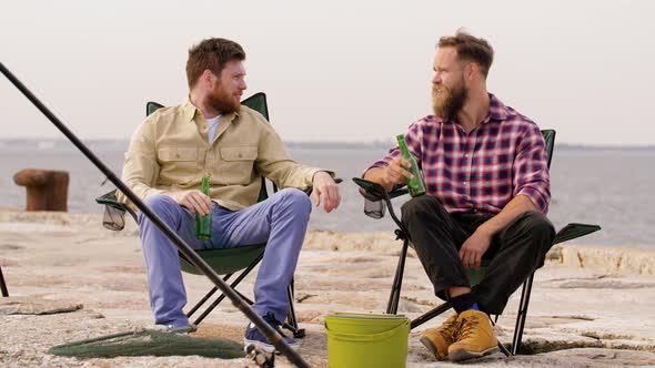 Happy Friends Fishing and Drinking Beer on Pier 51