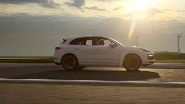 White Sports SUV and Wind Turbines