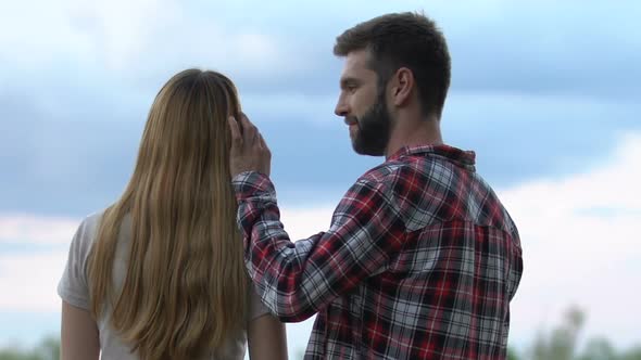 Happy Young Man and Woman Hugging and Looking Into Bright Future, Togetherness