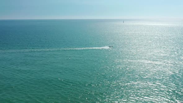 Aerial Footage of the Motorboat Within Endless Blue Sea