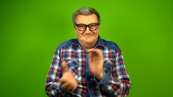 Mature Adult Strange Man in Stupid Glasses is Emotionally Claps His Hands