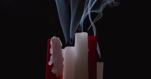 Smoke From Red and White Candles on the Black Background