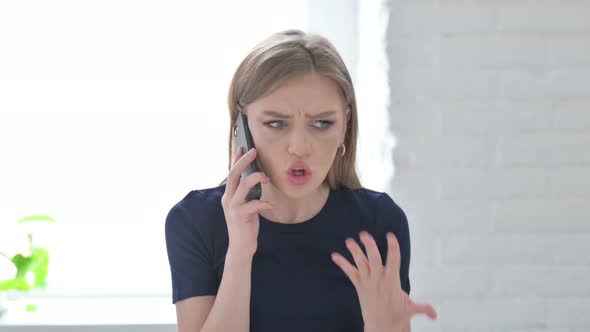 Portrait of Woman Talking Angrily on Smartphone