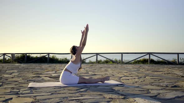 Slow motion shot of young woman doing yoga