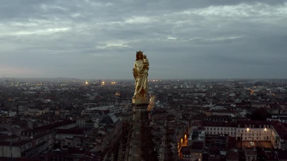Madonna and child statue on top of Pey Berland bell tower at St. Andrew's Cathedral, Bordeaux France