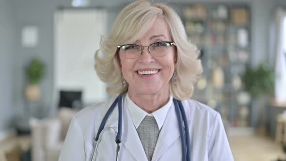 Portrait of Smiling Old Female Doctor