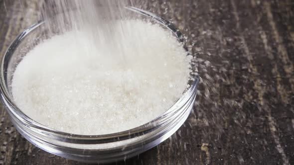 Slow Motion Pour Sugar Bowl on the Table Close-up