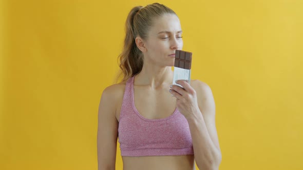 Portrait of Slender Girl Smelling Chocolate Then Saying No Avoiding Sugar Losing Weight