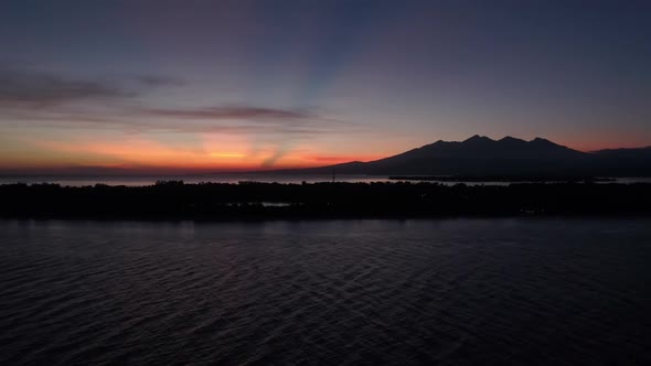 Aerial view of amazing sunset behind a mountain, Gili Trawangan, Indonesia.