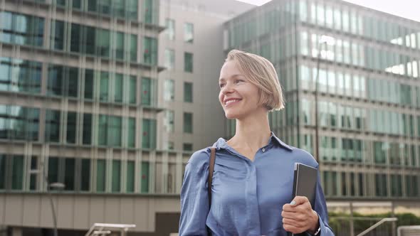 Confident Business Woman Walking in Outdoors Office City Carrying Laptop