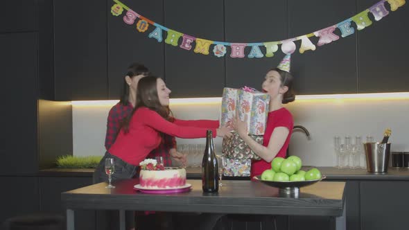 Guests Giving Gifts and Congratulating Excited Woman