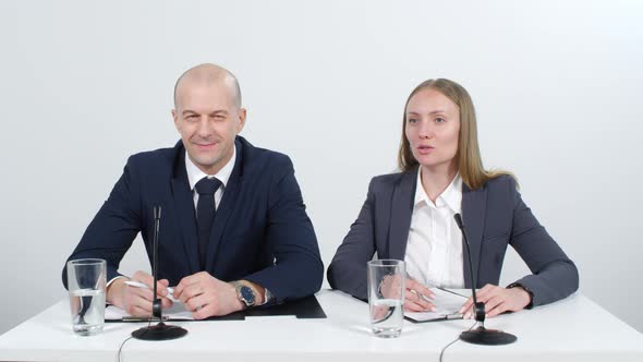 Colleagues Giving a Conference Talk