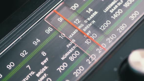 Tuning Analog Radio Dial Frequency on Scale of the Vintage Receiver