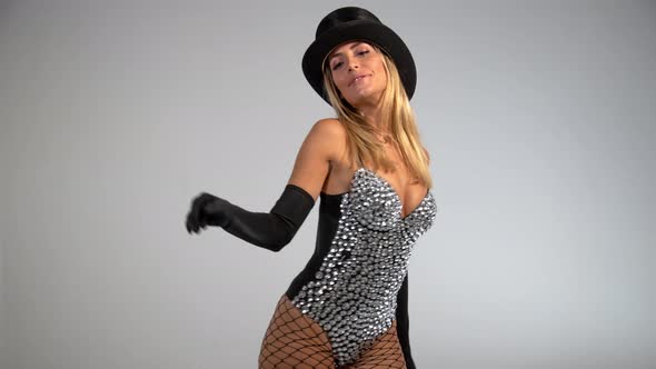 Young Woman Wearing Black Top Hat and Fishnets 