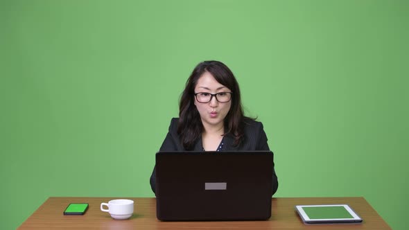 Mature Beautiful Asian Businesswoman Using Laptop