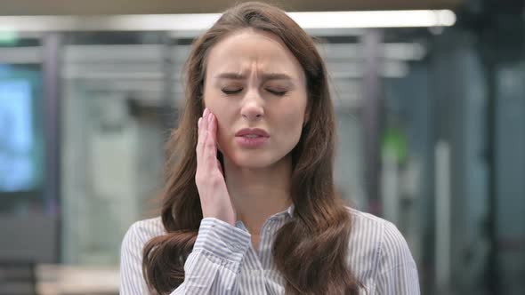 Portrait of Young Businesswoman having Toothache, Cavity