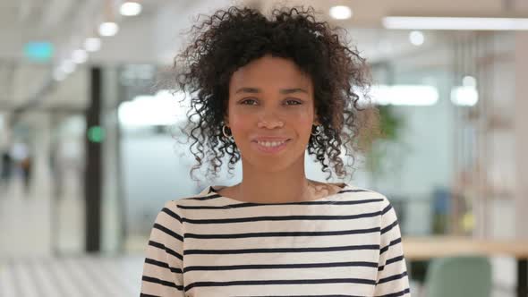 Smiling African Woman Looking at Camera