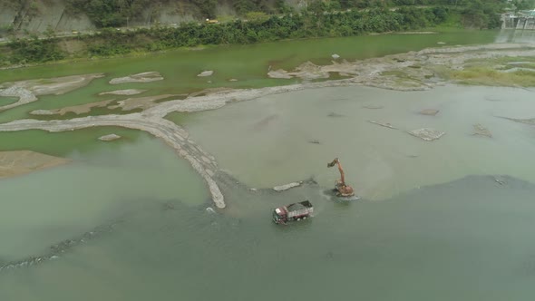 Cleaning and Deepening By a Dredger on the River. Philippines, Luzon