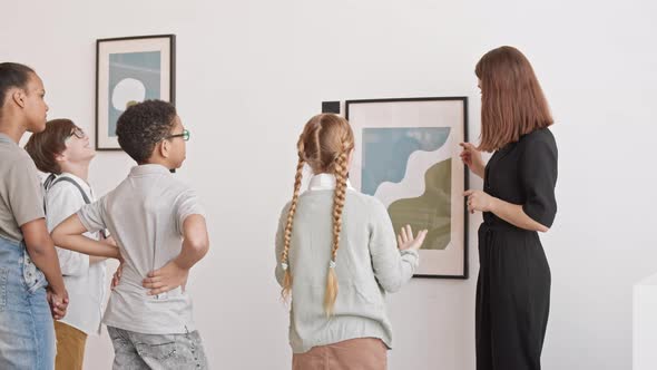 Children Talking to Art Gallery Worker
