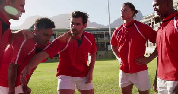 Team of rugby players planning their tactics on the rugby ground 4k