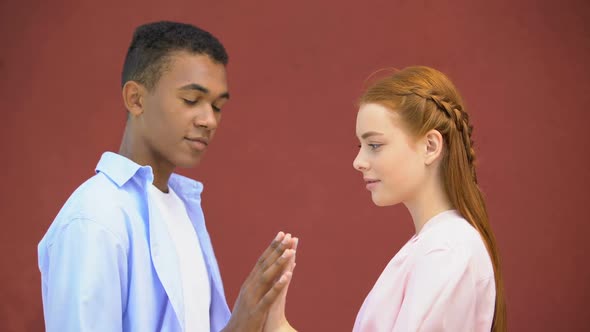 Multiracial Teen Boy and Girl Touching Hands, First Warm Feelings, Affection