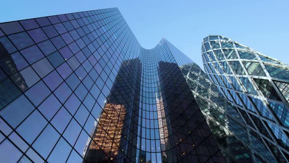 Business district building with wall mirror with blue sky