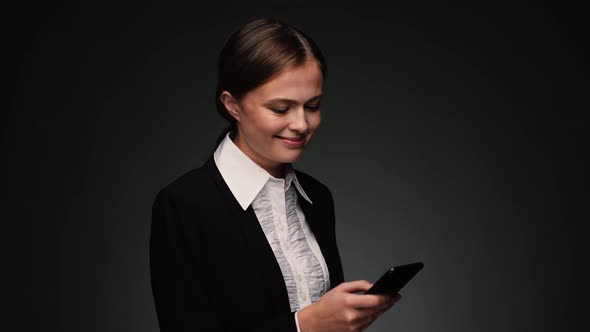 Brunette Businesswoman with Phone Texting