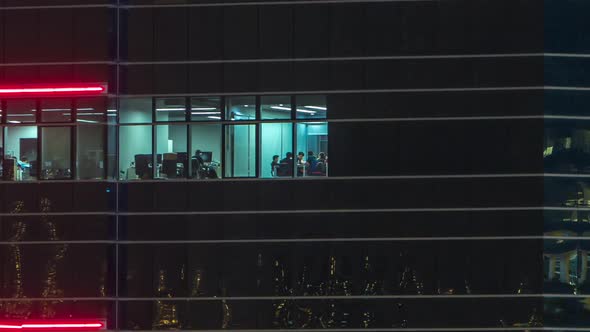 Windows in Modern City Office Building at Night Timelapse